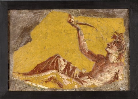 Fragment of a wall painting showing a man reclining to drink. Da Pompei, I sec. - Copyright the Trustees of the British Museum