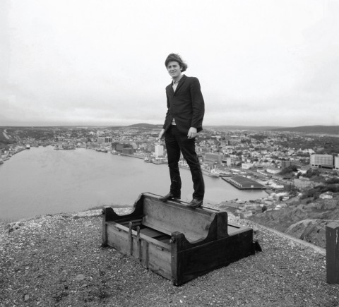 Thaddeus Holownia, Gordon Monahan standing on piano, Gibbet's Hill, St. John's, NF (1988)