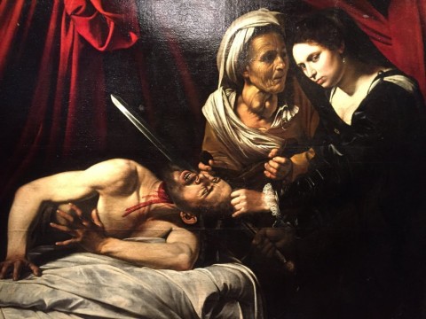 La Giuditta che decapita Oloferne attribuita a Caravaggio