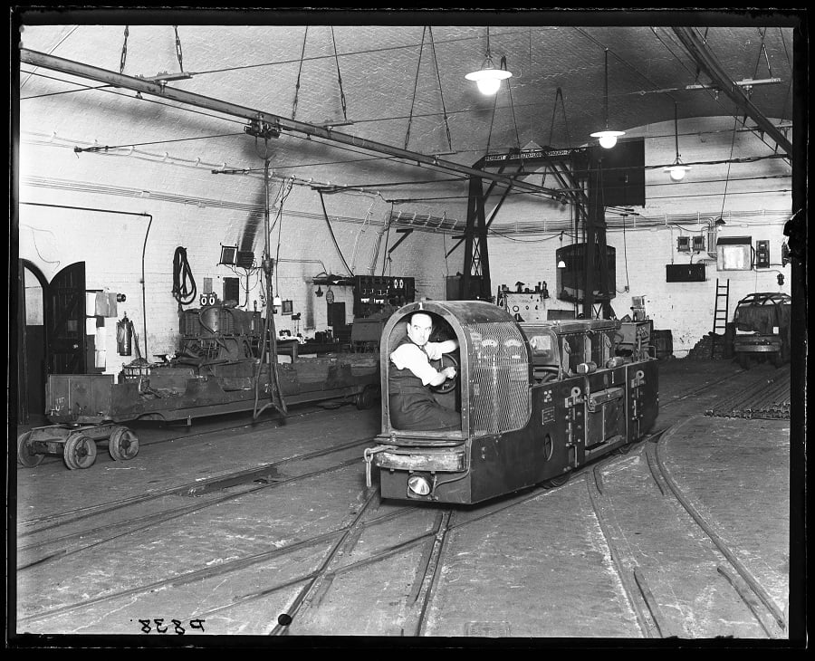 Post Office underground railway - man operating a shunting vehicle, 1935