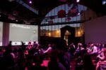 Pecha Kucha Night Neu Marx Vienna – vista parziale della sala all’interno del padiglione Rinderhalle Il Rinderhalle, ovvero la Pelanda di Vienna. Serve una Pecha Kucha Night per scoprire uno straordinario spazio per il contemporaneo…