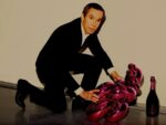 Jeff Koons con il Balloon per Dom Pérignon Art Digest: Koons Pérignon da 20mila dollari. Uomini nudi a casa degli impressionisti. San Damien Hirst, protettore di Londra