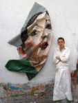 Rupert Shrive standing next to his post painting Chinese girl PVC 2008 Shrive il lussurioso