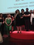 Premio Maxxi 2014 la cerimonia 9 Va a Marinella Senatore il Premio Maxxi 2014. Il suo progetto di arte partecipativa la impone sugli altri finalisti Micol Assaël, Linda Fregni Nagler e Yuri Ancarani