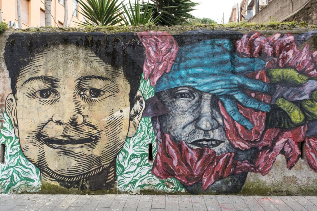 L’anima sociale della street art romana e il cuore multietnico di Torpignattara. Finito il muro dei migranti. E parte il crowdfunding per il film