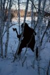 Jimmie Durham, yakutia. Making a pole to mark the center of the world (left and right) and pretending to be the mouse girl from a cartoon (centre),  1995 – still da video - photo Yrjö Haila -  courtesy of the artist