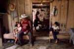 Steve McCurry, A family gathers for breakfast before a day of work, La Fortuna, Honduras, 2004