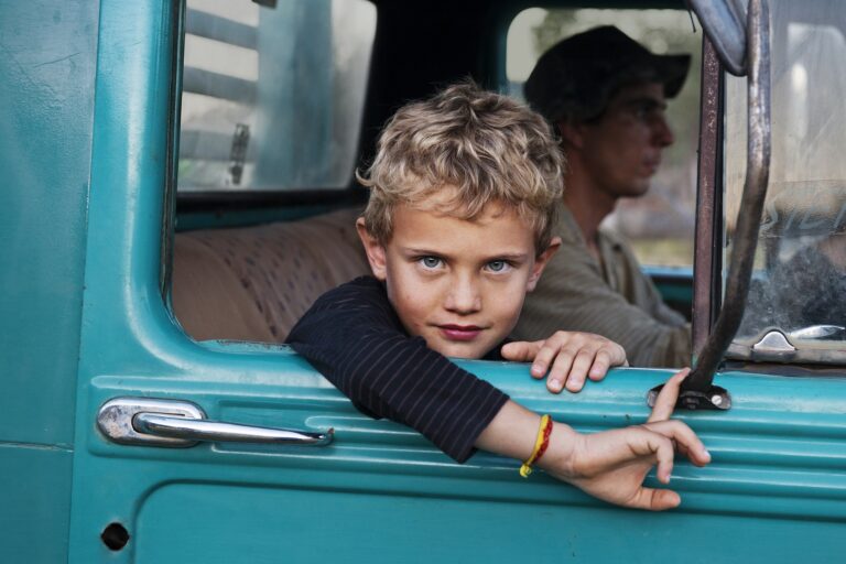 Steve McCurry, A farmer's son in his father's truck, Lambari, Brazil, 2010