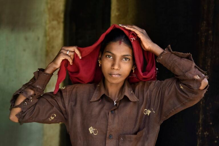 Steve McCurry, A plantation worker adjusts her headscarf, Karnataka, India, 2014