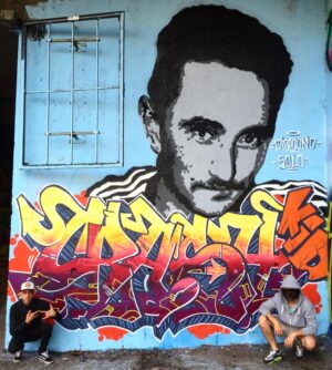 Roma, reportage da un graffiti day. Celebrando Crash Kid: immagini, memorie, emozioni. La scena hip-hop e il nuovo muro dedicato a un fratello scomparso