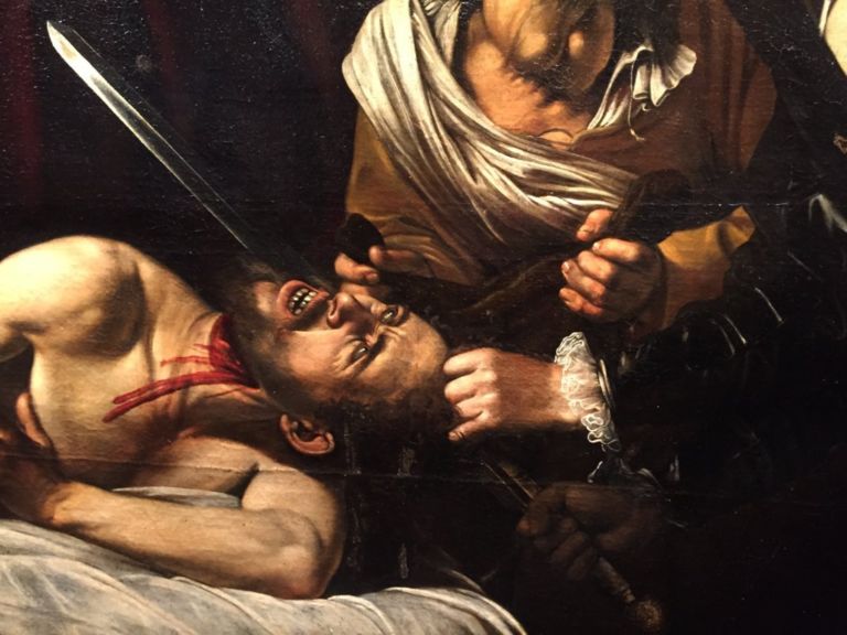 Particolare della Giuditta che decapita Oloferne attribuita a Caravaggio È di Caravaggio questa Giuditta e Oloferne trovata in una soffitta di Tolosa? Se autentica, 120 milioni di valore