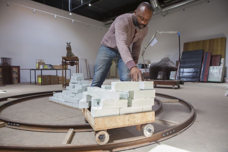 Theaster Gates with Goat in his studio, Chicago, 2014, photo Sara Pooley