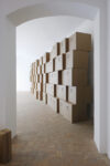 Zimoun, 149 prepared dc-motors, tension springs, felt balls, cardboard boxes 70x70x70cm. Credits Paolo Terzi