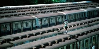 Boy Running on Top of Train, CC Yard, Bronx, NY, 1983 ©Martha Cooper