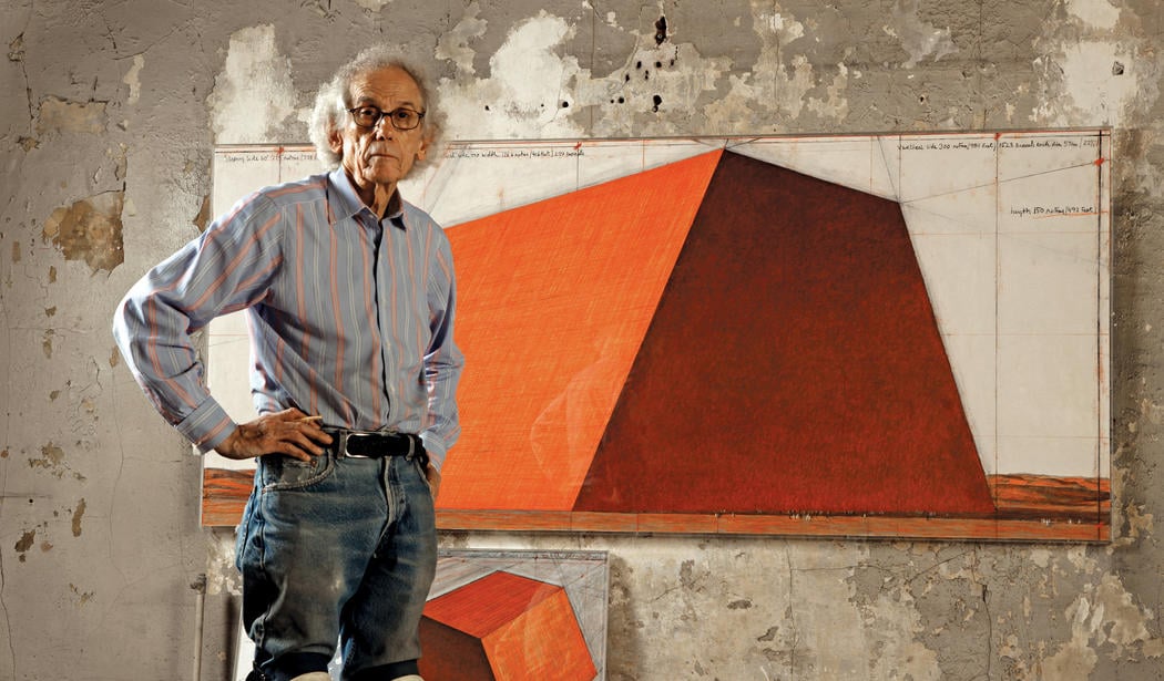 Christo in his studio with a preparatory drawing for The Mastaba, New York City, 2012. Photo Wolfgang Volz