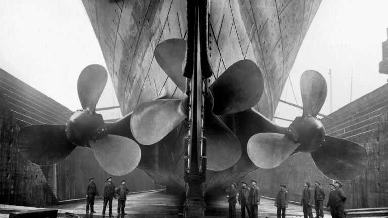 Vintage maritime history photo of the RMS Titanics propellers as the mighty ship sits in dry dock.