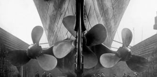 Vintage maritime history photo of the RMS Titanics propellers as the mighty ship sits in dry dock.