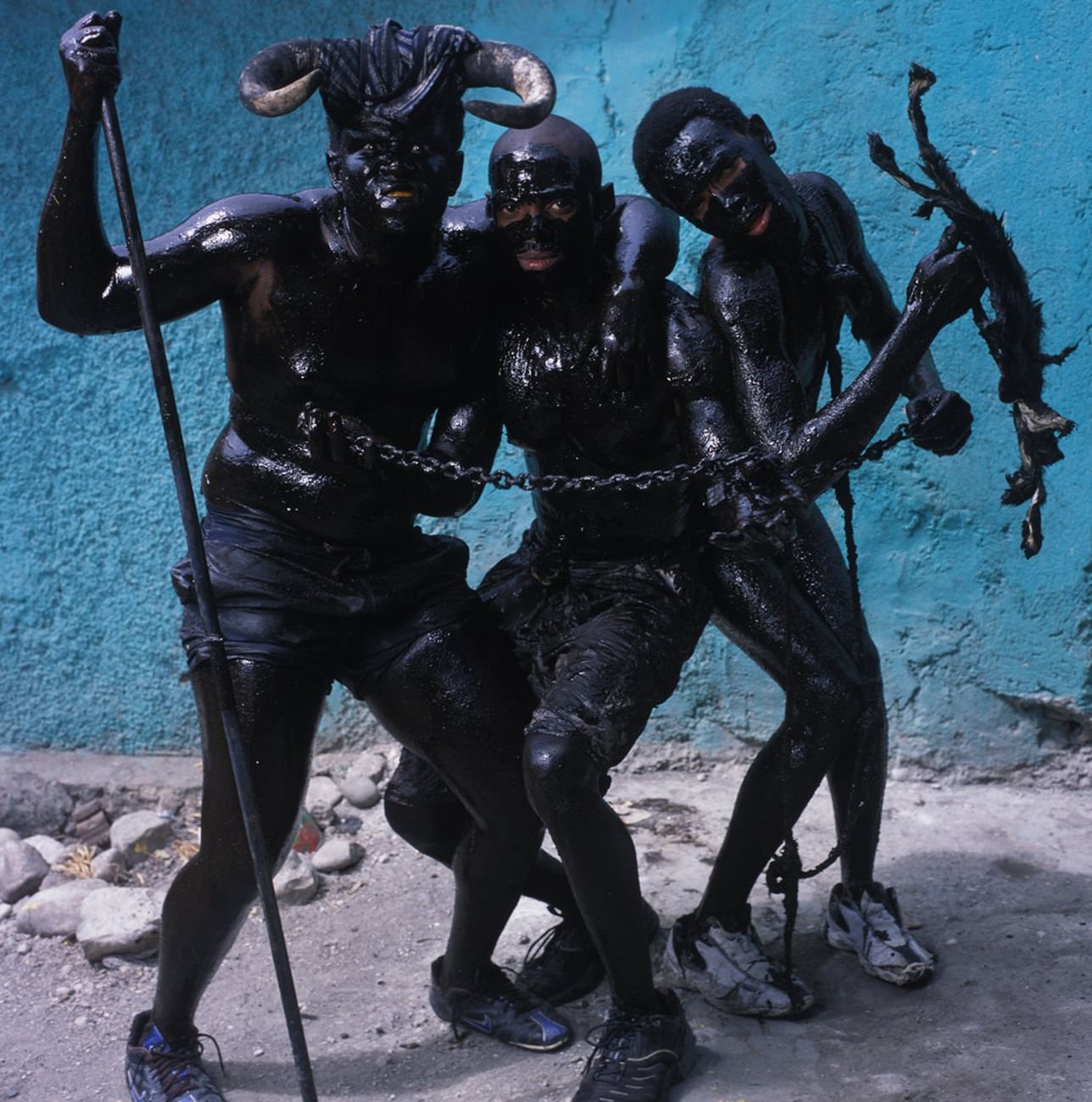 Phyllis Galembo, Three Men With Chains, 2004. Courtesy Sindika Dokolo Foundation, Bruxelles