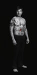 Shirin Neshat, Amir (Villains) from the series The Book of Kings, 2012, gelatin silver print with acrylic, 99 × 49 1/2 in., Los Angeles County Museum of Art, gift of Lynda and Stewart Resnick through the 2017 Collectors Committee, © Shirin Neshat, photo courtesy the artist and Gladstone Gallery, New York and Brussels