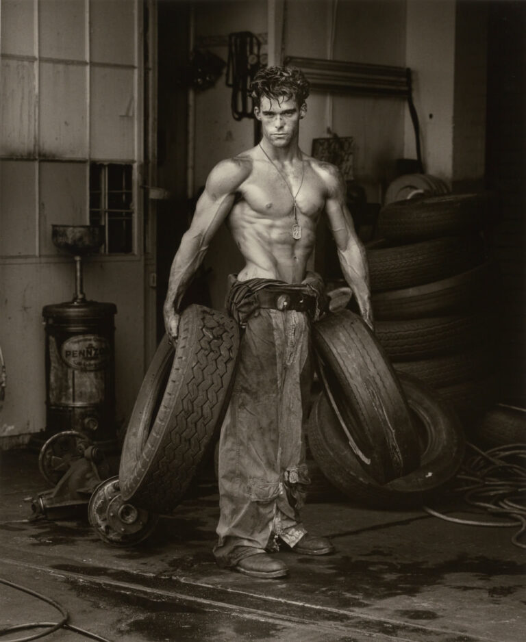 Herb Ritts, Fred with Tires, Hollywood [Body Shop series], 1984, Copyright © Herb Ritts Foundation, Object Credit The J. Paul Getty Museum, Los Angeles, Gift of Herb Ritts Foundation