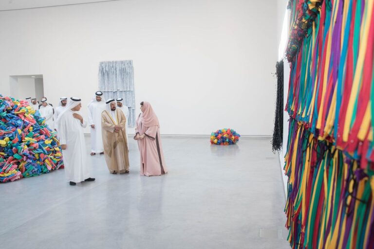 HH Sheikh Dr Sultan bin Mohammed Al Qasimi, Member of the Supreme Council, Ruler of Sharjah and Sharjah Art Foundation President Sheikha Hoor Al Qasimi touring Hassan Sharif, I Am The Single Work Artist, 2017, Image courtesy of Sharjah Media