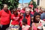 Il vescovo ausiliare di Roma Sud don Paolo Lojudice a sinistra don Luigi Ciotti al centro e i manifestanti con le magliette rosse. Foto Avvenire Essere o non essere radical chic. L‘ossessione impazza sul web