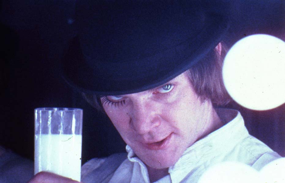 A Clockwork Orange, directed by Stanley Kubrick (1970-71; GB/United States). Alex DeLarge (Malcolm McDowell) in the Korova Milkbar. Still image. © Warner Bros. Entertainment Inc.