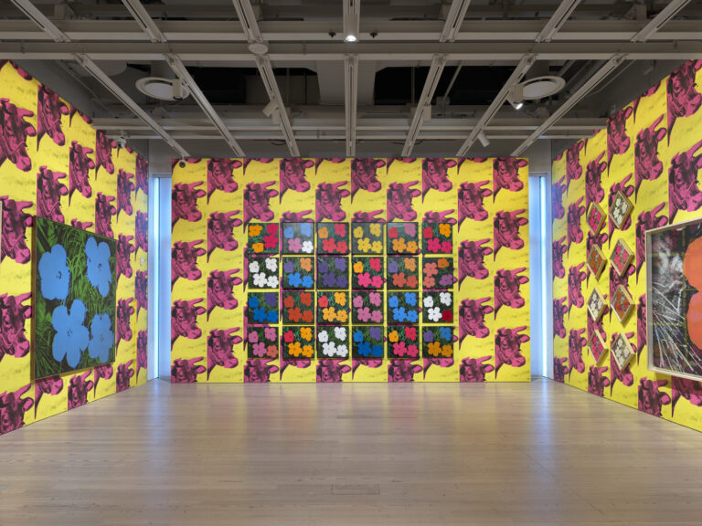 Installation view of Andy Warhol – From A to B and Back Again (Whitney Museum of American Art, New York, November 12, 2018-March 31, 2019). From left to right, top to bottom: Flowers, 1964; Flowers, 1964; Flowers, 1964; Flowers, 1964; Flowers, 1964; Flowers, 1964; Flowers, 1964; Flowers, 1964; Flowers, 1964; Flowers, 1964; Flowers, 1964; Flowers, 1964; Flowers, 1964; Flowers, 1964; Flowers, 1964; Flowers, 1964; Flowers, 1964; Flowers, 1964; Flowers, 1964; Flowers, 1964; Flowers, 1964; Flowers, 1964; Flowers, 1964; Flowers, 1964; Flowers, 1964; Flowers [Large Flowers], 1964-65. Photograph by Ron Amstutz. © 2018 The Andy Warhol Foundation for the Visual Arts, Inc. / Licensed by Artists Rights Society (ARS), New York