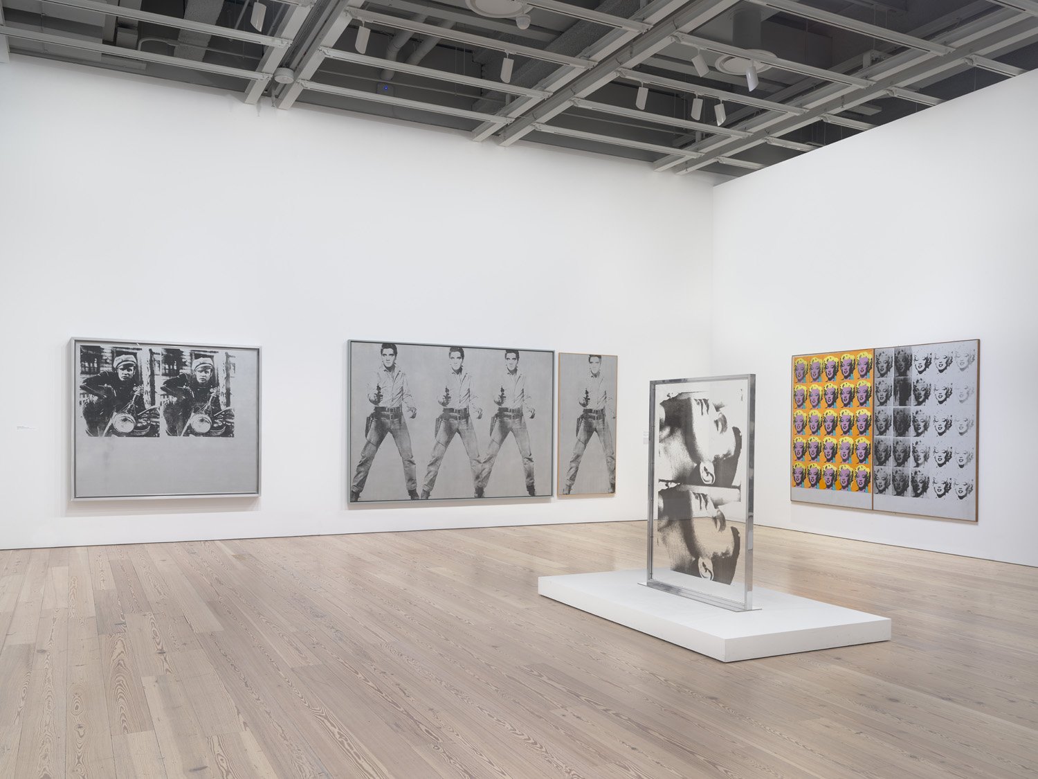 Installation view of Andy Warhol – From A to B and Back Again (Whitney Museum of American Art, New York, November 12, 2018-March 31, 2019). From left to right: Silver Marlon, 1963; Triple Elvis [Ferus Type], 1963; Single Elvis [Ferus Type], 1963; Large Sleep, 1965; Marilyn Diptych, 1962. Photograph by Ron Amstutz. © 2018 The Andy Warhol Foundation for the Visual Arts, Inc. / Licensed by Artists Rights Society (ARS), New York