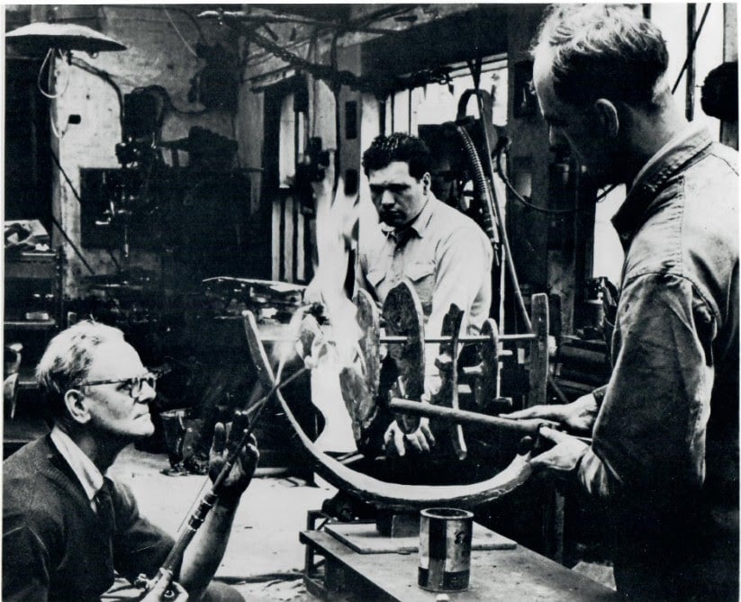 Eduardo Paolozzi in a workshop making Forms on a Bow No.2, early 1950s.