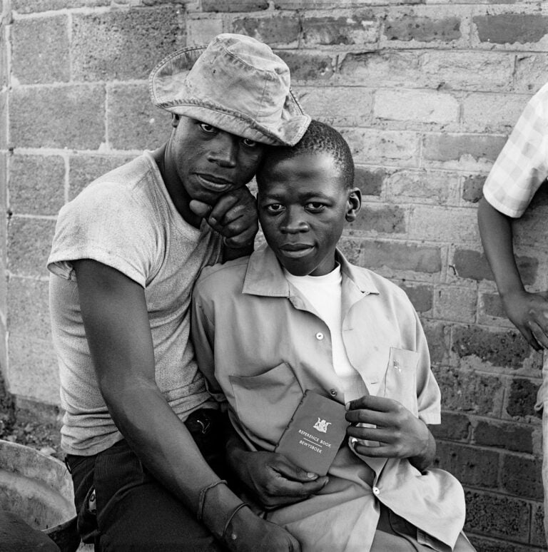 David Goldblatt, Young men with dompas (an identity document that every black South African had to carry), White City, Jabavu, Soweto 1972, silver gelatin photograph on fibre-based paper. Image courtesy Goodman Gallery, Johannesburg and Cape Town © The David Goldblatt Legacy Trust