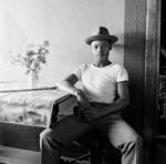 David Goldblatt, Young man at home, White City, Jabavu, Soweto 1972, silver gelatin photograph on fibre-based paper. Image courtesy Goodman Gallery, Johannesburg and Cape Town © The David Goldblatt Legacy Trust