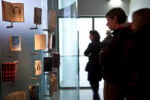 Visitors looking at scale models of the Secret Annex © Anne Frank House. Photographer Cris Toala Olivares