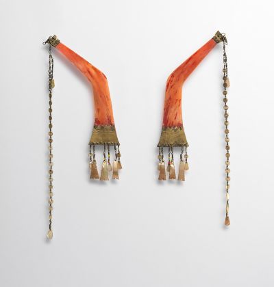 Man's Ear Ornaments (Batling) Late 19th–early 20th century Philippines, Ilongot people Hornbill ivory, metal, shell, glass beads Width 6-3/4 in. The Metropolitan Museum of Art, Gift of Jean Paul and Monique Barbier-Mueller, 1988 (1988.125.4a, b)