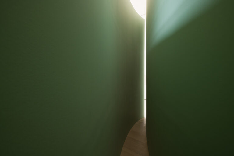 Bruce Nauman (American, born 1941). Kassel Corridor: Elliptical Space. 1972. Painted wallboard, wood, and door hardware. Exhibition copy. Outer wall: 144 × 564" (365.8 × 1432.6 cm), Inner wall: 144 × 558" (365.8 × 1417.3 cm), Width at center: 27" (68.6 cm), Width at ends: 4" (10.2 cm). Solomon R. Guggenheim Museum, New York. Panza Collection. Installation view, Bruce Nauman: Disappearing Acts at The Museum of Modern Art, New York (October 21, 2018–February 25, 2019, at MoMA and MoMA PS1). © 2018 Bruce Nauman/Artists Rights Society (ARS), New York. Digital image © 2018 The Museum of Modern Art, New York. Photo: Martin Seck