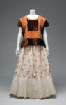 Velvet huipil with machine-embroidered chain stitch; cotton skirt with printed floral motifs and holán (ruffle). © Diego Rivera and Frida Kahlo Archives, Banco de México, Fiduciary of the Trust of the Diego Rivera and Frida Kahlo Museums. (Photo: Javier Hinojosa, courtesy of V&A Publishing)