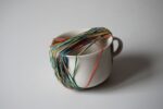 Ermanno Cristini, To be late with white cup one, 2016, elastici su tazza, 10x10x7 cm. PROGR, Berna