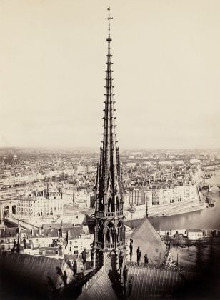 Charles François Bossu, Notre Dame de Paris, France. View of_spire, roof with statuary and cityscape beyond via Wikipedia