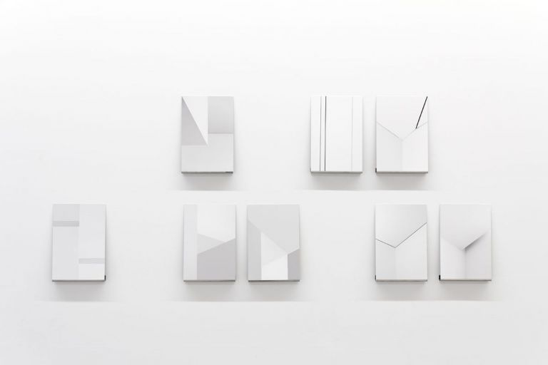 Michele Spanghero, Studies on the Density of White, 2010 – Ongoing, Inkjet prints on fine art paper mounted on stainless steel, displayed on stainless steel shelves, Unique +1EA 30 x 20 cm (work), 4 shelves: 2 x 20 x 3 cm, 1 shelf : 3 x 100 x 3 cm, courtesy Galleria Alberta Pane and the artist