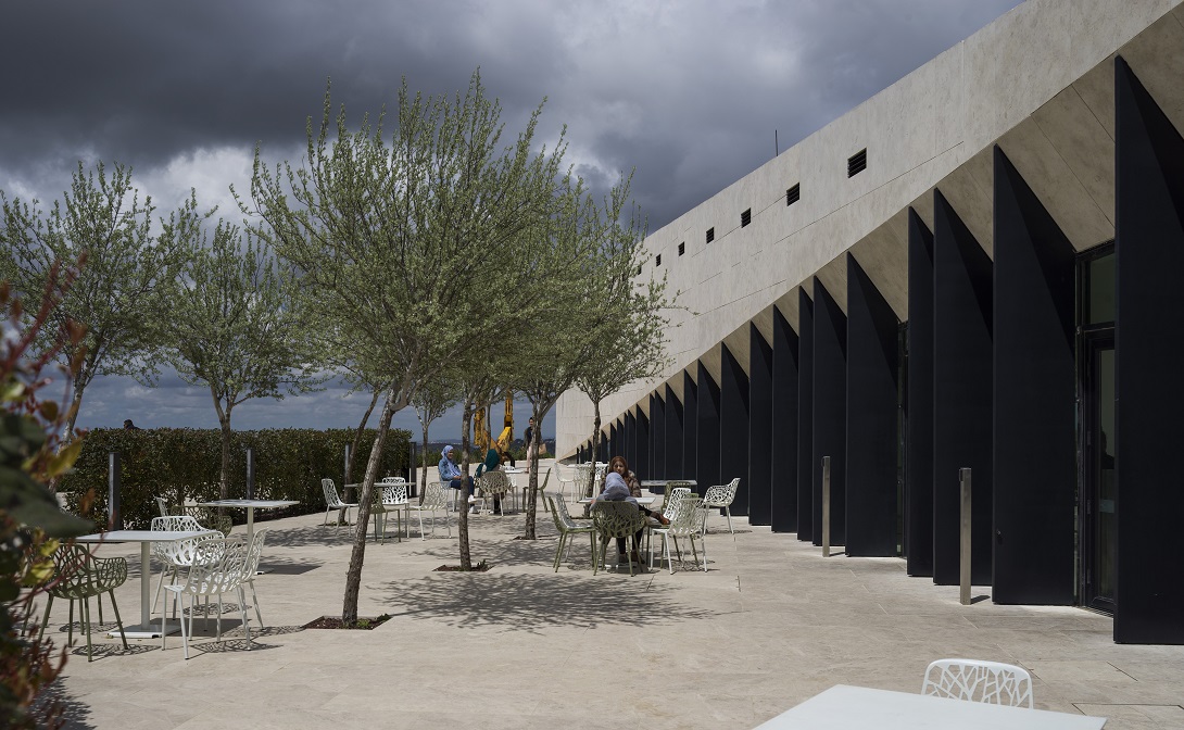 Visitors enjoying the museum’s shaded terrace, Palestinian Museum, Birzeit, Palestine. | Aga Khan Trust for Culture / Cemal Emden (photographer)