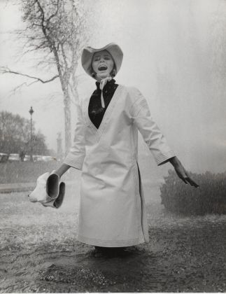 Jill Kennington wearing white PVC rain tunic and hat. Photo John Cowan, 1963. Image © Ernestine Carter Archive. Courtesy Fashion Museum Bath