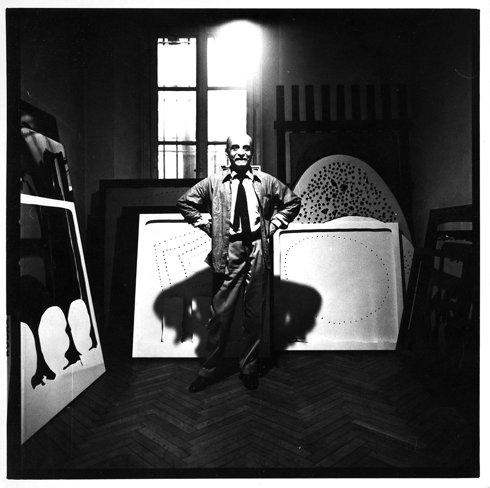 Lucio Fontana in his studio, Milan (Corso Monforte), ca. 1965 © Fondazione Lucio Fontana by SIAE 2019 Courtesy Fondazione Lucio Fontana, Milano