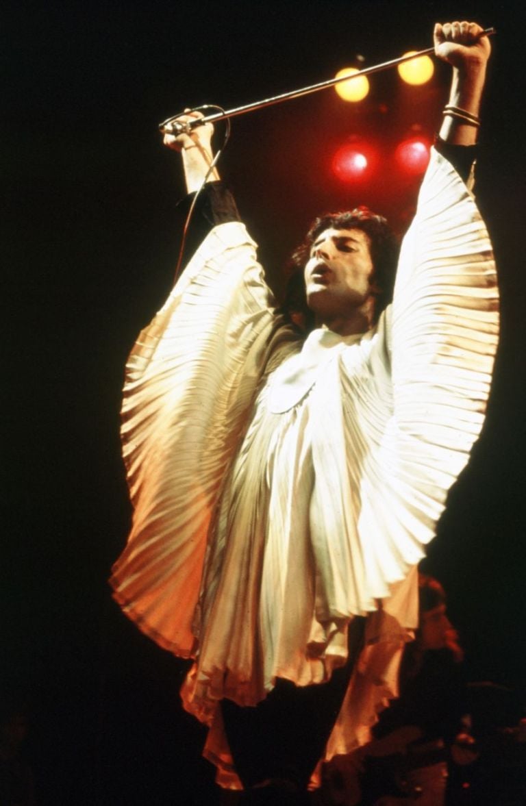 Freddie Mercury and Brian May of Queen wear Zandra Rhodes tops on stage, 1974. Photo Douglas Puddifoot