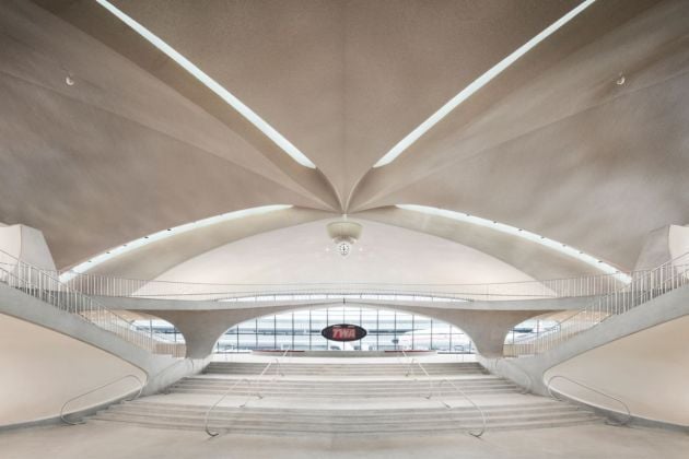 A view toward The Sunken Lounge (and the hotel’s 1958 Lockheed Constellation “Connie”) from the terminal’s front entrance. Photo credits TWA Hotel – David Mitchell