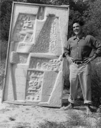 Costantino Nivola with sand cast (negative) of maquette for William E. Grady Vocational High School. Courtesy of the Nivola family archive. Photo Carl Stein