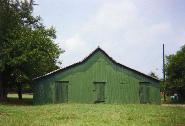 William Christenberry Green Warehouse, Newbern, Alabama, 1978 brownie pigment print on Hahnemule photo satin paper 3-3/8" × 5" (8.6 cm × 12.7 cm), image 8" × 10" (20.3 cm × 25.4 cm), paper Edition 4 of 25 Edition of 25 + 5 Aps © William Christenberry, courtesy Pace Gallery