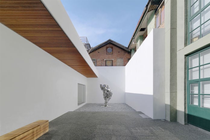 Sculpture of Zhan Wang in the renovated courtyard of Long March Space, image courtesy of Long March Space, photo by Wang Hongyue