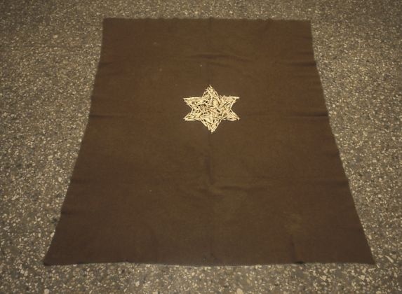 Mel Bochner, Yiskor (For the Jews of Rome), 1993, Burnt matchsticks on army blanket on floor, 60 x 50 1/2 in. (152.4 x 128.3 cm). Courtesy the artist