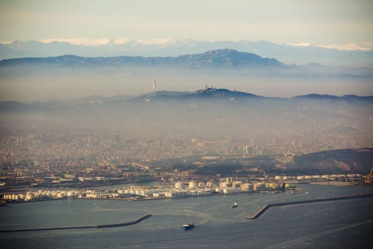 Barcelona with pollution. Photo © Jon Tugores