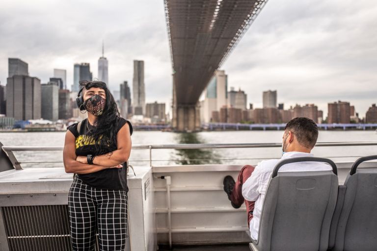 Francesca Magnani, A woman stands in front of me crossing her arms, Manhattan Bridge, East River Route, September 3 2020